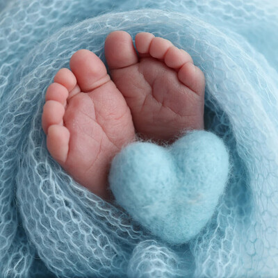 kids feet wrapped in towel with blue fluffy heart